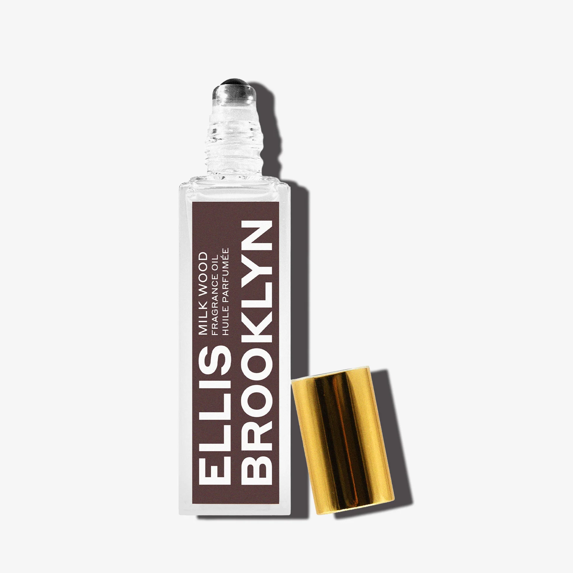 Ellis Brooklyn Milk Wood bottle with dramatic lighting