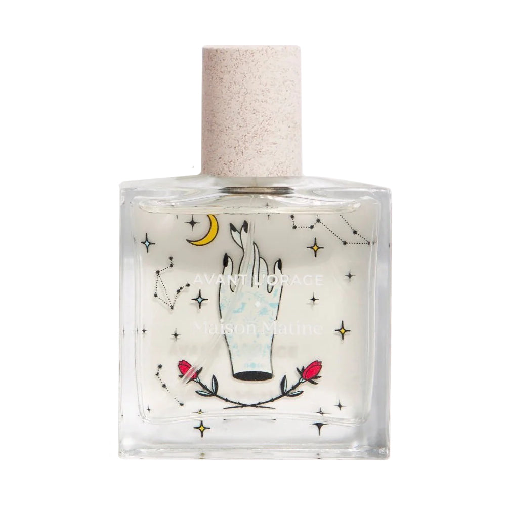 Perfume bottle with decorative label featuring a hand, moon, and stars on a white background