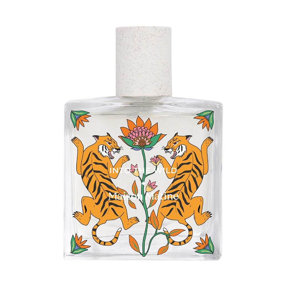 Perfume bottle with tiger design on a white background