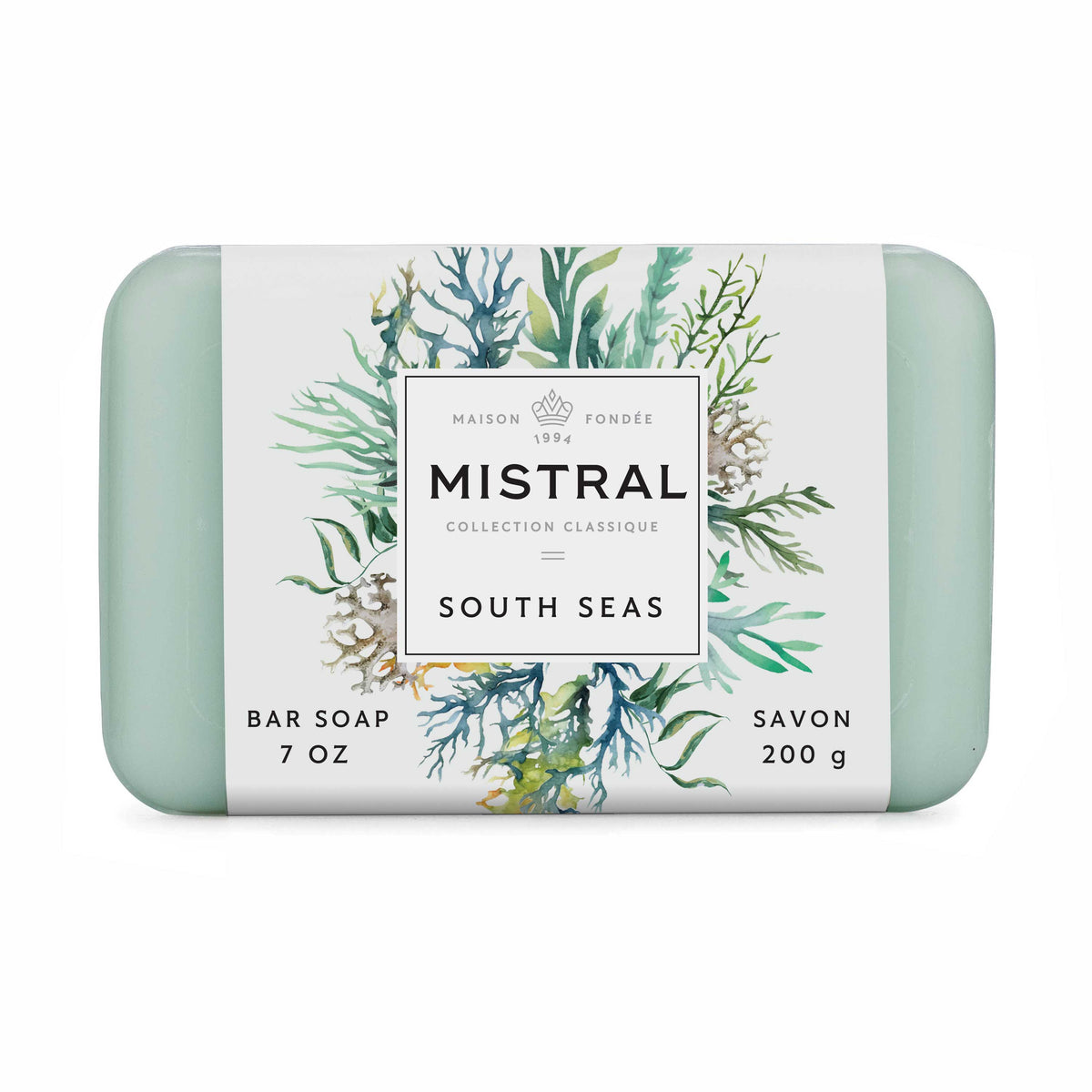 A rectangular bar of Maison Fondée Mistral South Seas collection bar soap, 7 oz (200 g), wrapped in a white paper label with green and blue botanical illustrations and mint green rounded corners.