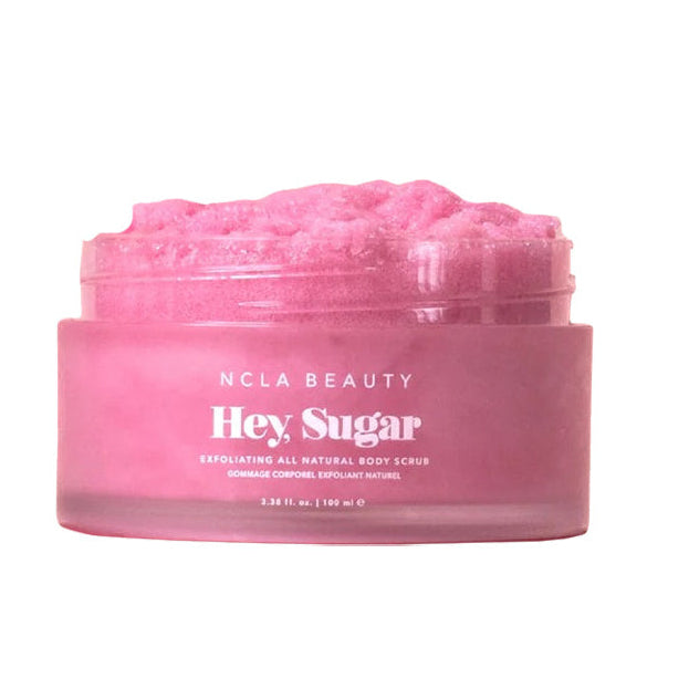 Pink jar of NCLA Beauty Hey Sugar body scrub on a white background