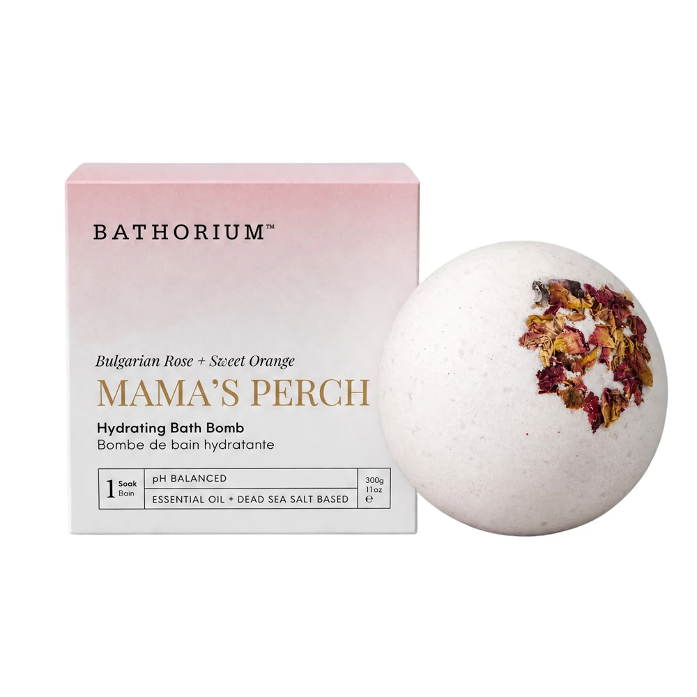 Bathorium Mama's Perch Hydrating Bath Bomb shown next to its pink and white packaging box on a clean white background.