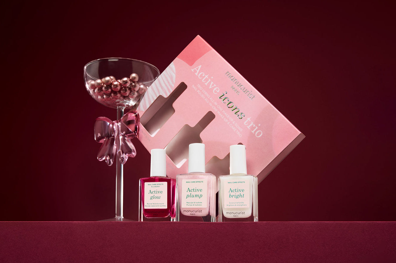 Set of Manucurist products with a pink box on a red background