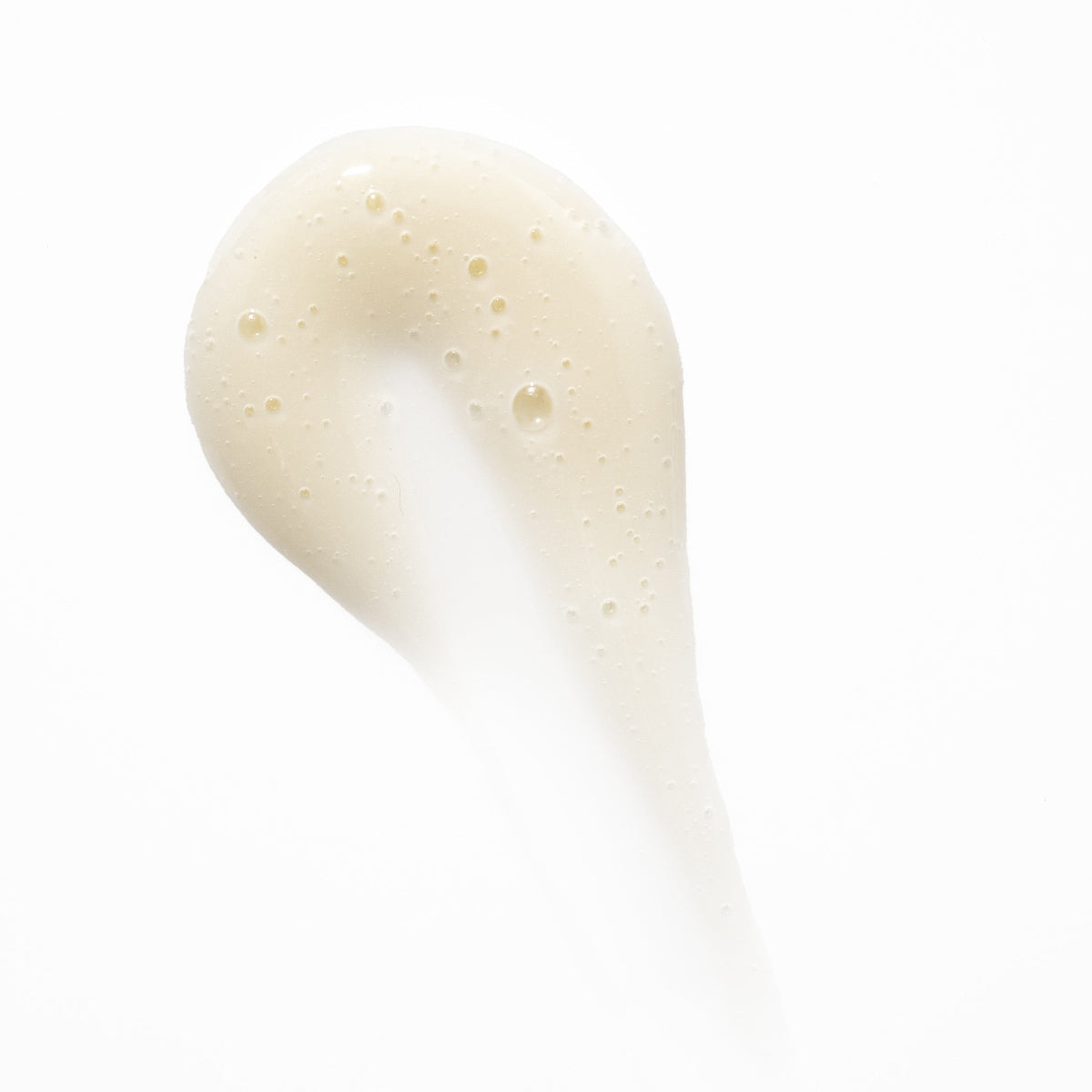 Close-up of a beige cream on a white background