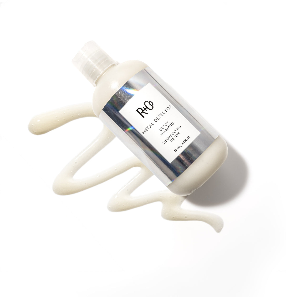 R+Co Detox Detector Shampoo bottle on a white background