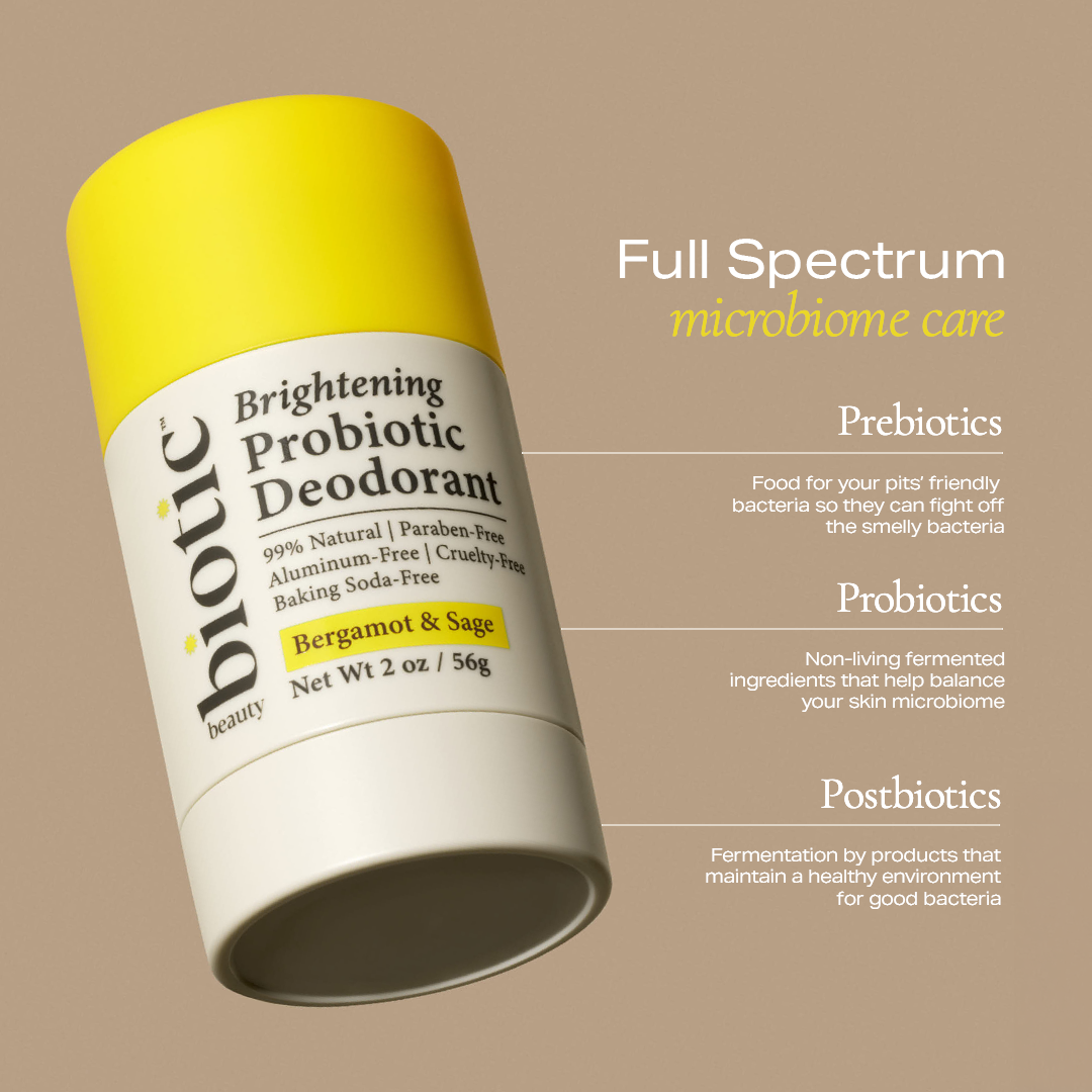 Biotic Beauty's Brightening Probiotic Deodorant on a brown background next to a list of the microbiome care ingredients included in the deodorant. (Prebiotics, Probiotics, and Postbiotics).