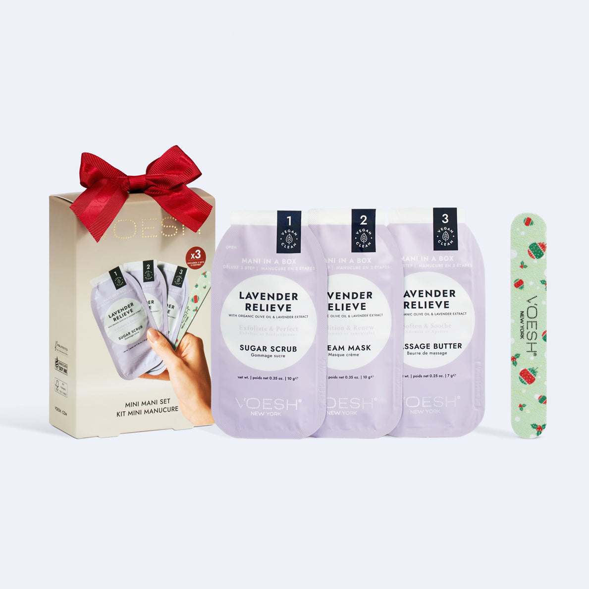 Set of lavender skincare products with a gift box and red bow on a white background