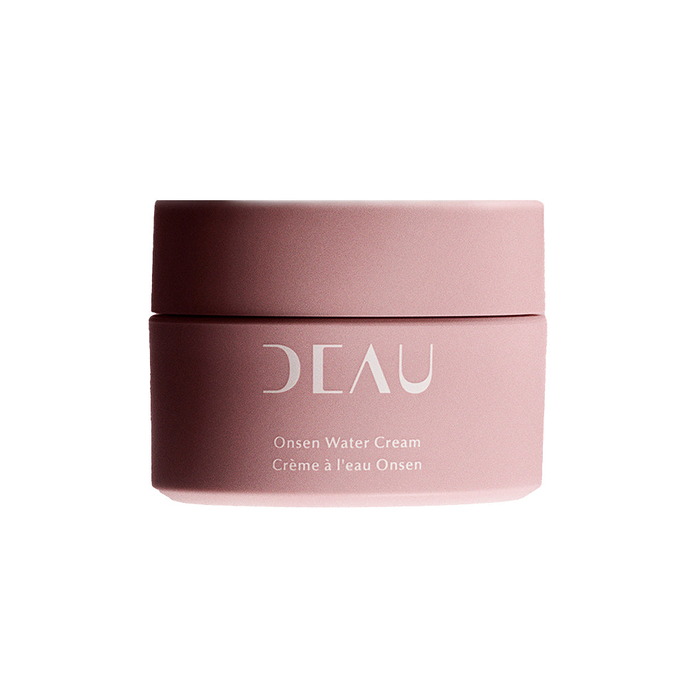 Pink jar of DEAU Onsen Water Cream on a white background