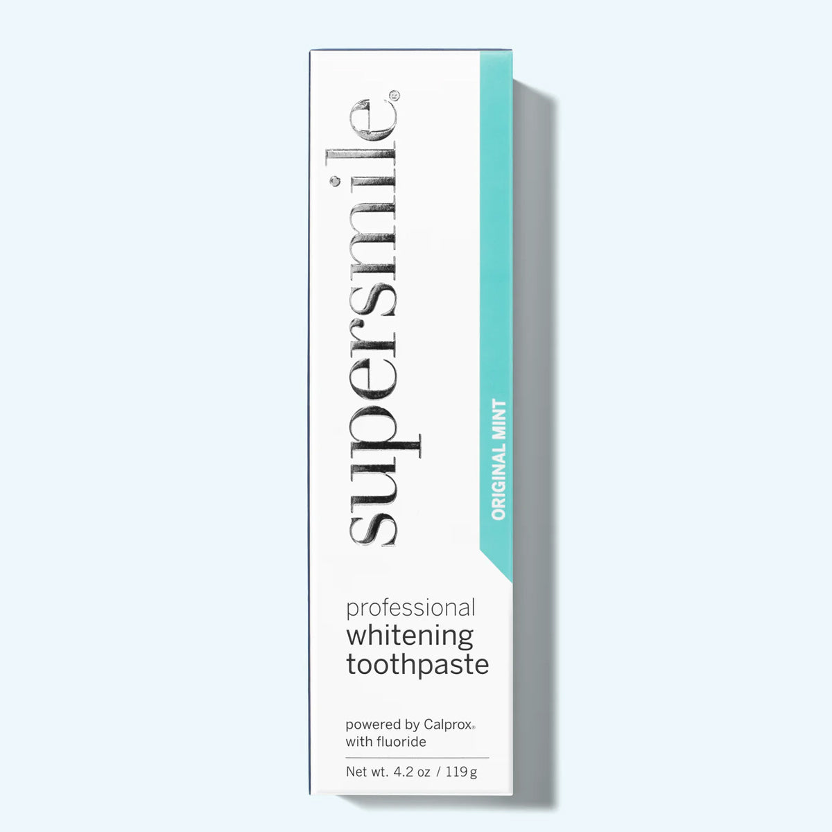 Supersmile professional whitening toothpaste box on a light gray background