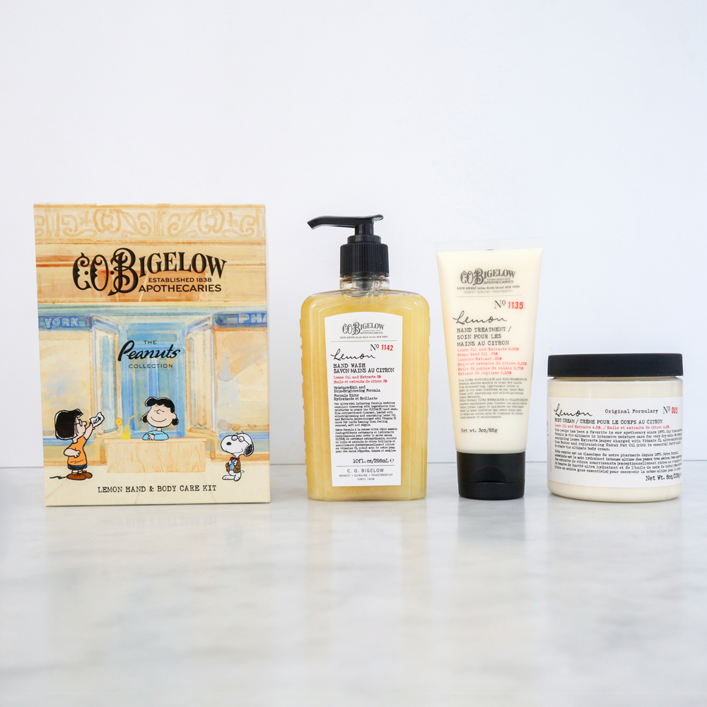 Peanuts® x C.O. Bigelow Lemon Bath & Body Care Apothecary Box with Body Cream, Hand Wash & Hand Treatment on a white background displayed on a marble surface