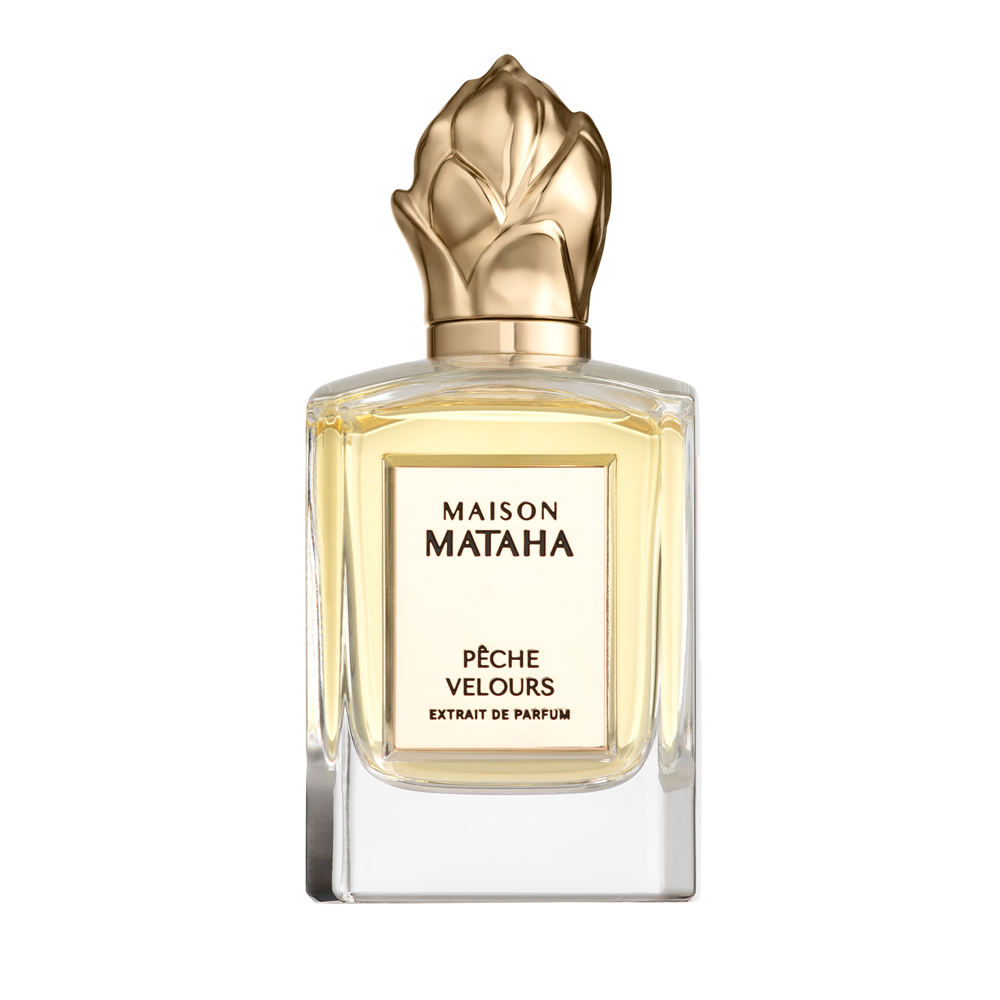 Bottle of Peche Velours - Extrait de Parfum with gold cap n a white background