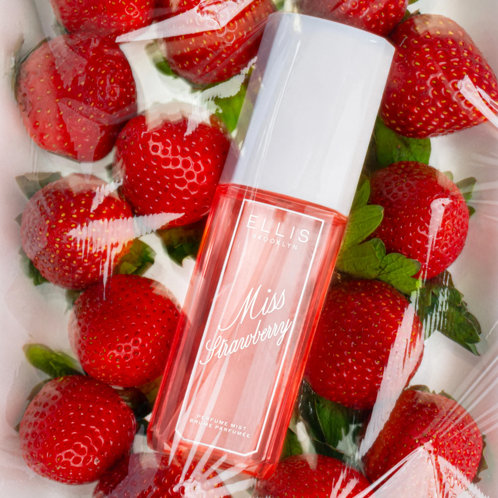 Ellis Brooklyn Miss Strawberry perfume bottle surrounded by strawberries
