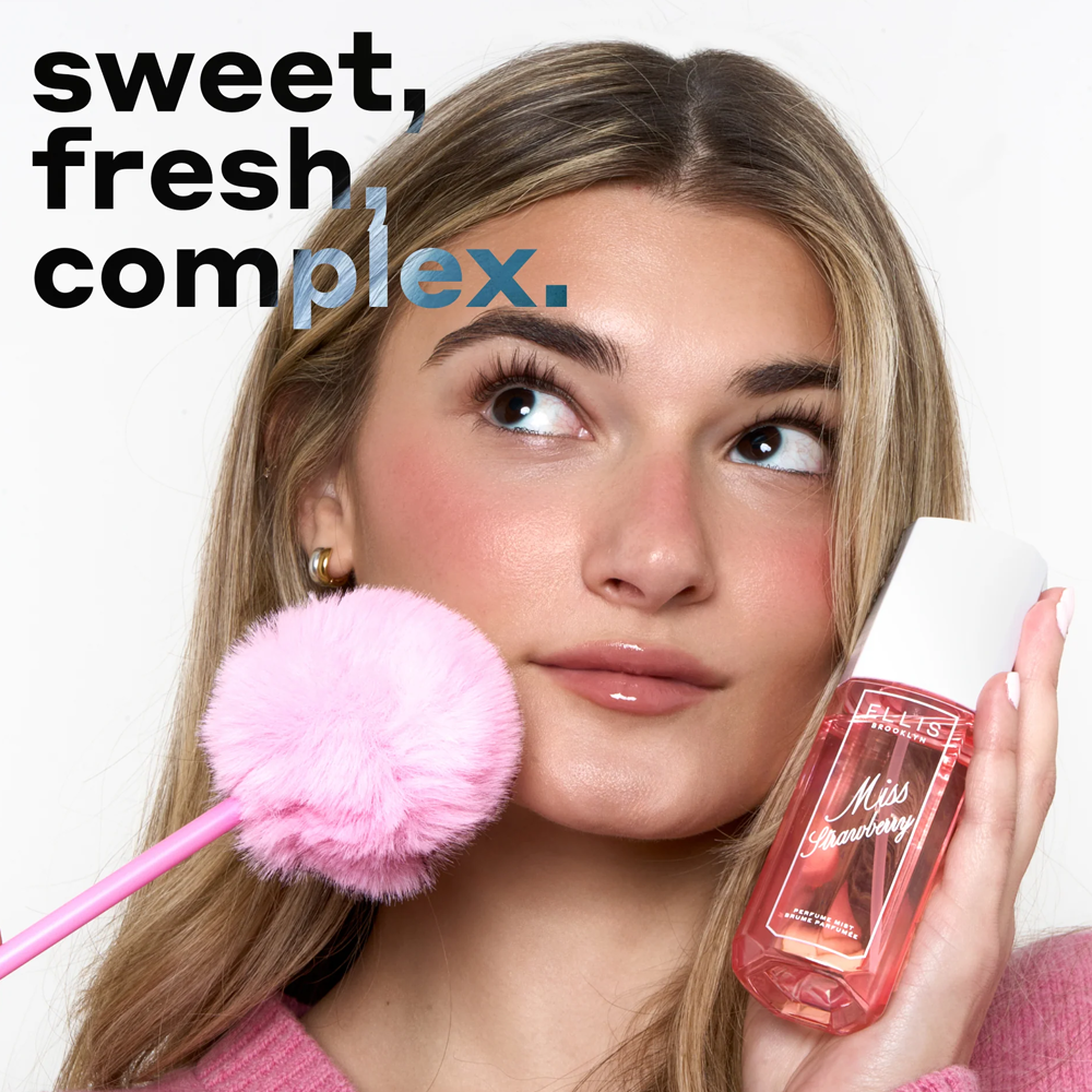 Woman holding a pink makeup brush and a bottle with text 'sweet, fresh complex.'