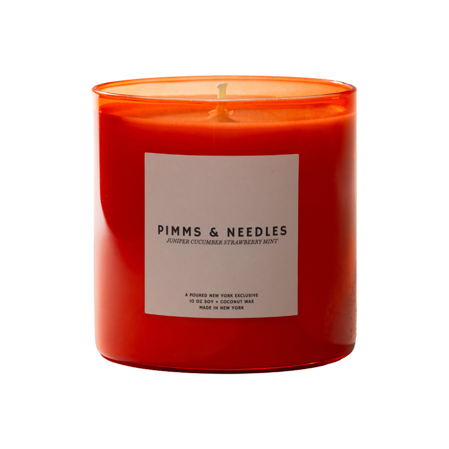 Red candle with a label on a white background