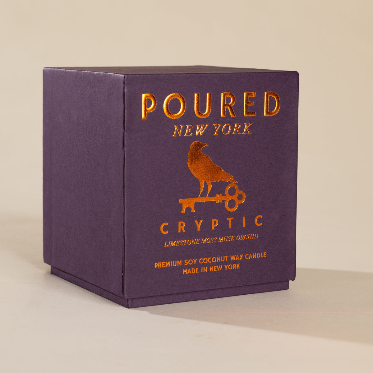 Cryptic Candle Packaging on grey background 