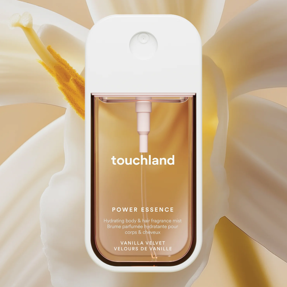 Touchland power essence bottle with vanilla velvet fragrance on a beige and flowery background
