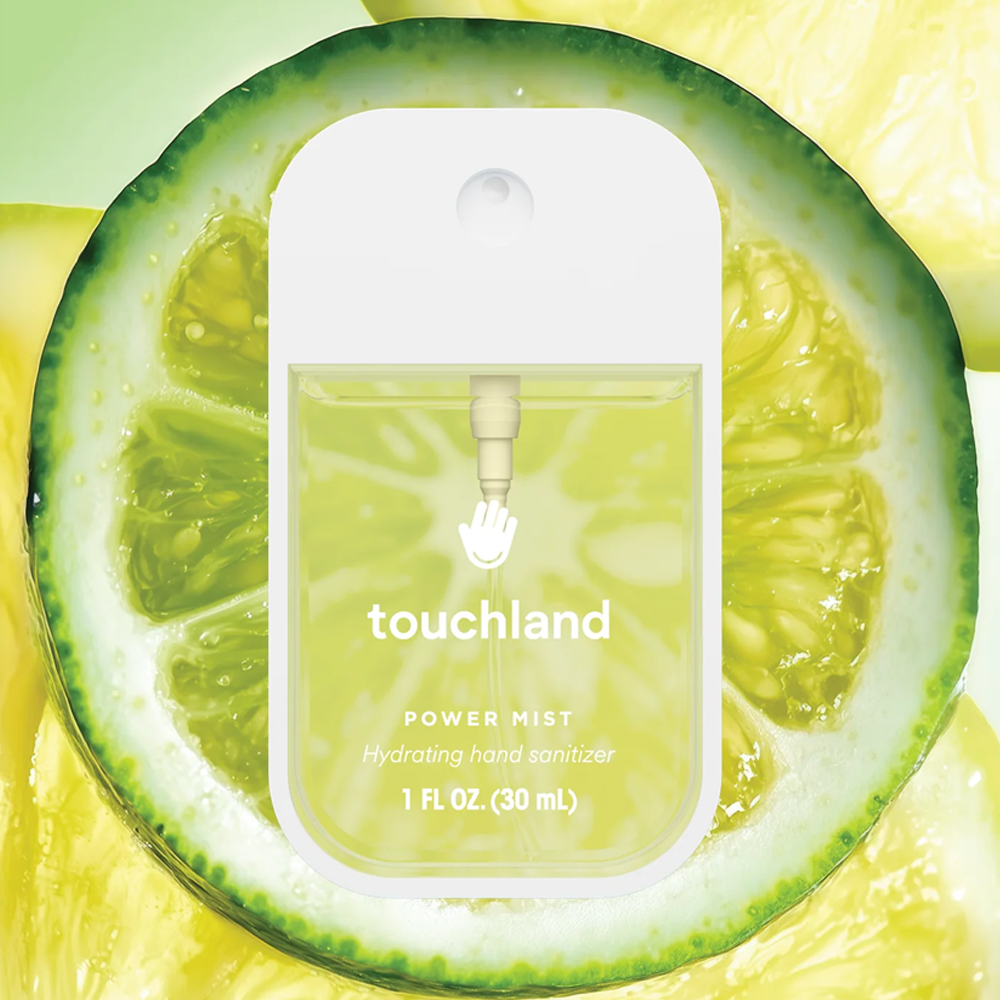 Touchland power mist hydrating hand sanitizer packaging with a lime slice background.