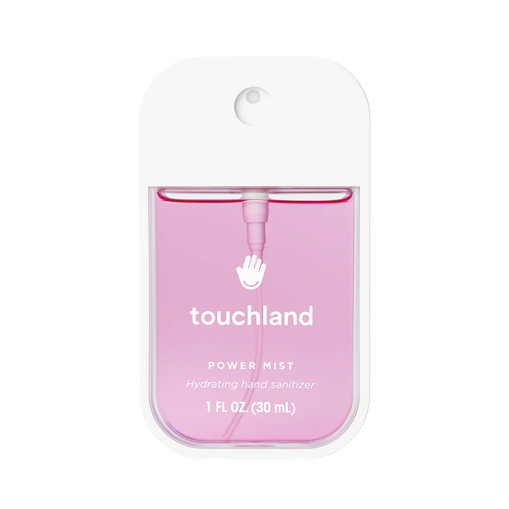 Pink hand sanitizer with 'touchland' branding on a white background