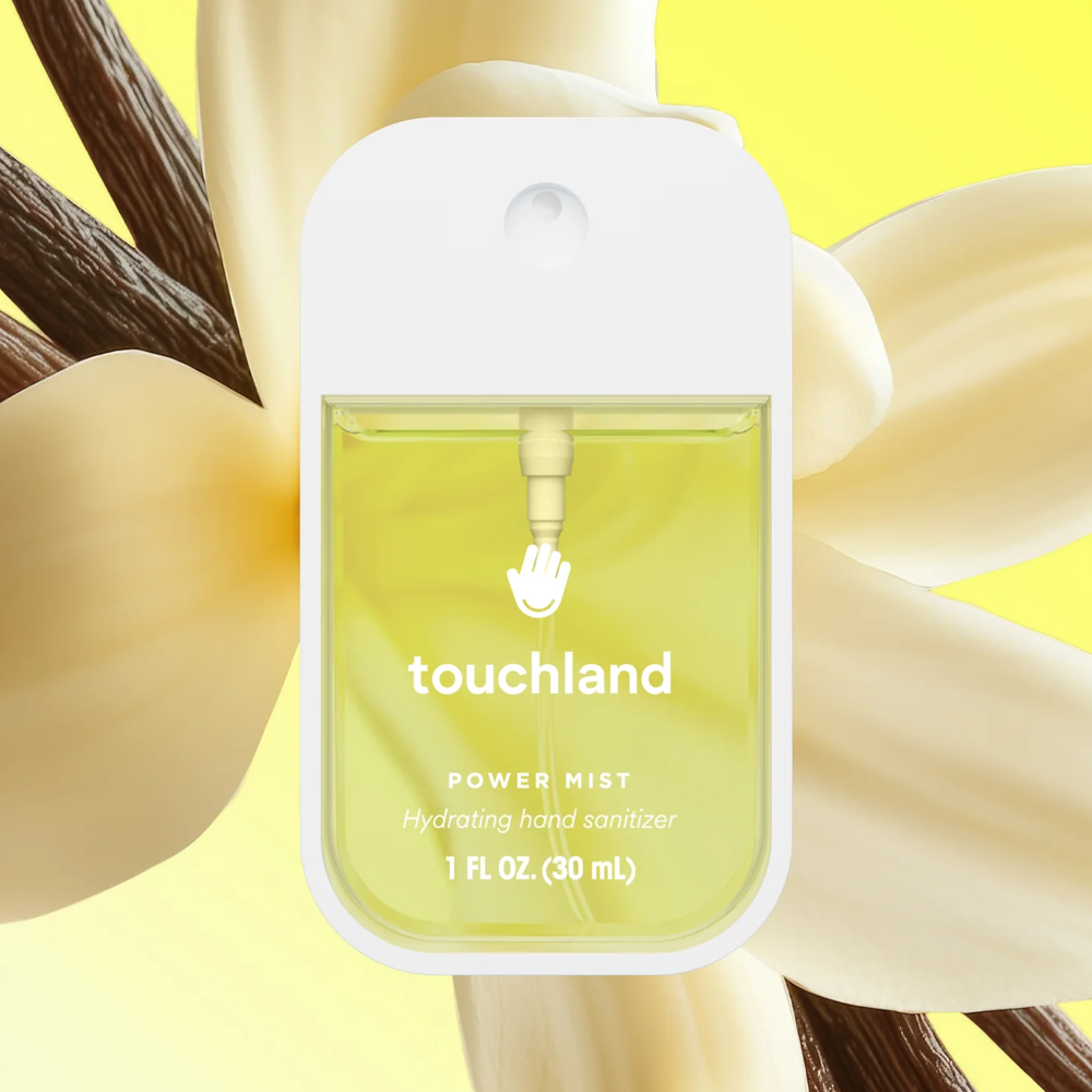 Touchland hand sanitizer bottle with vanilla in the background