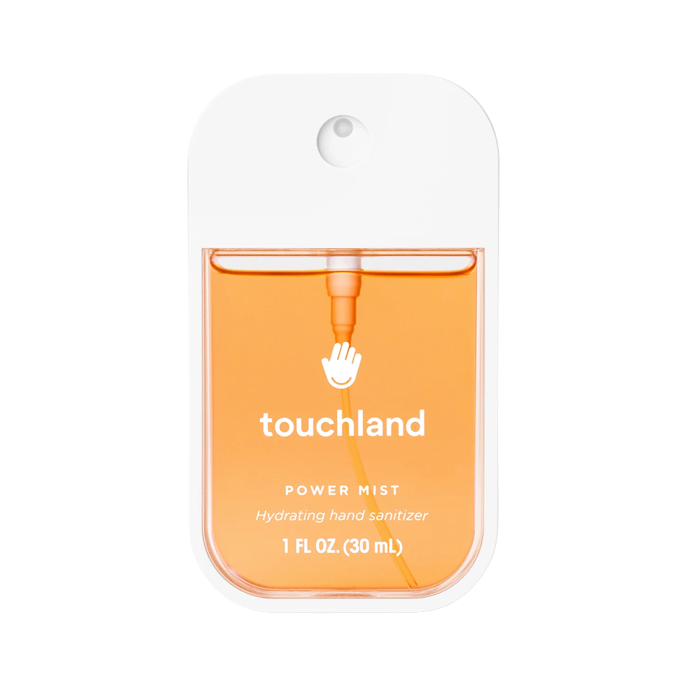 Orange hand sanitizer packaging with 'touchland' branding on a white background