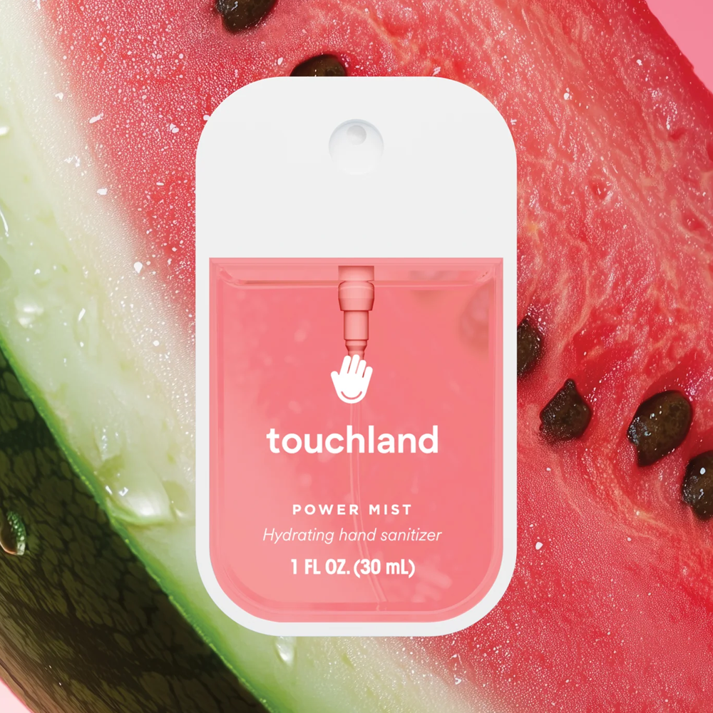 Touchland power mist hand sanitizer on a watermelon background