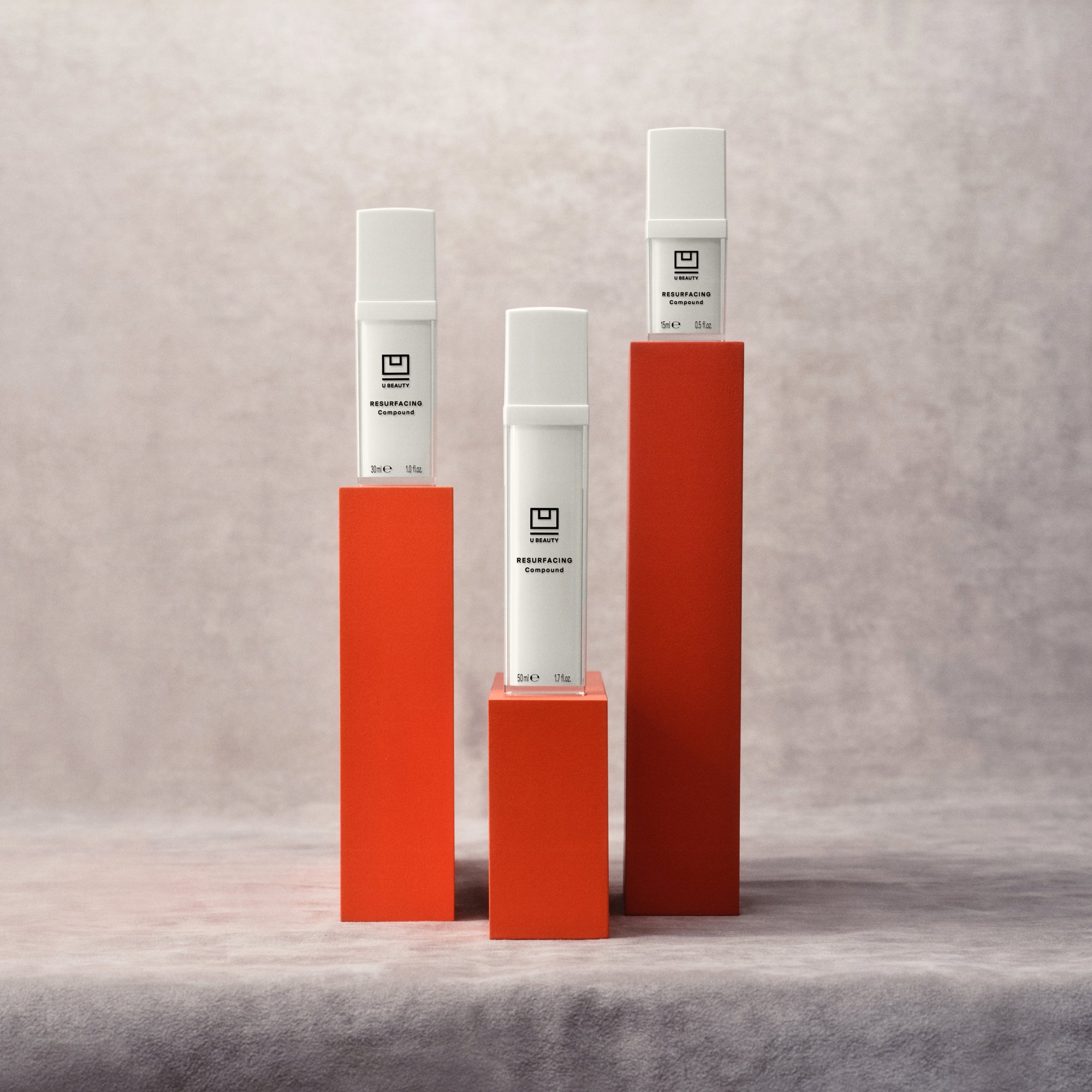 U Beauty Resurfacing Compound in three sizes on red pedestals. 