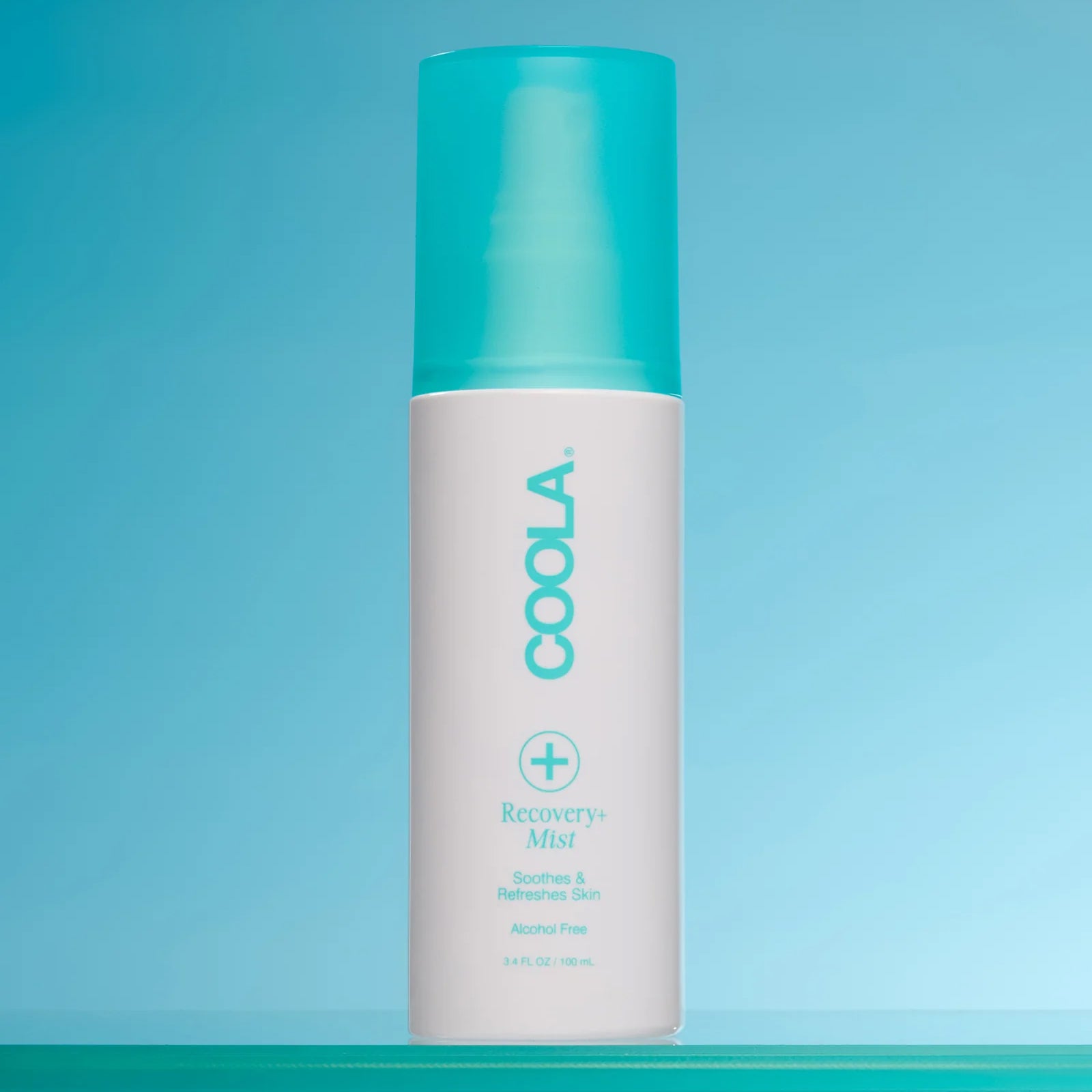 COOLA Recovery+ Mist product on a blue/aquatic background