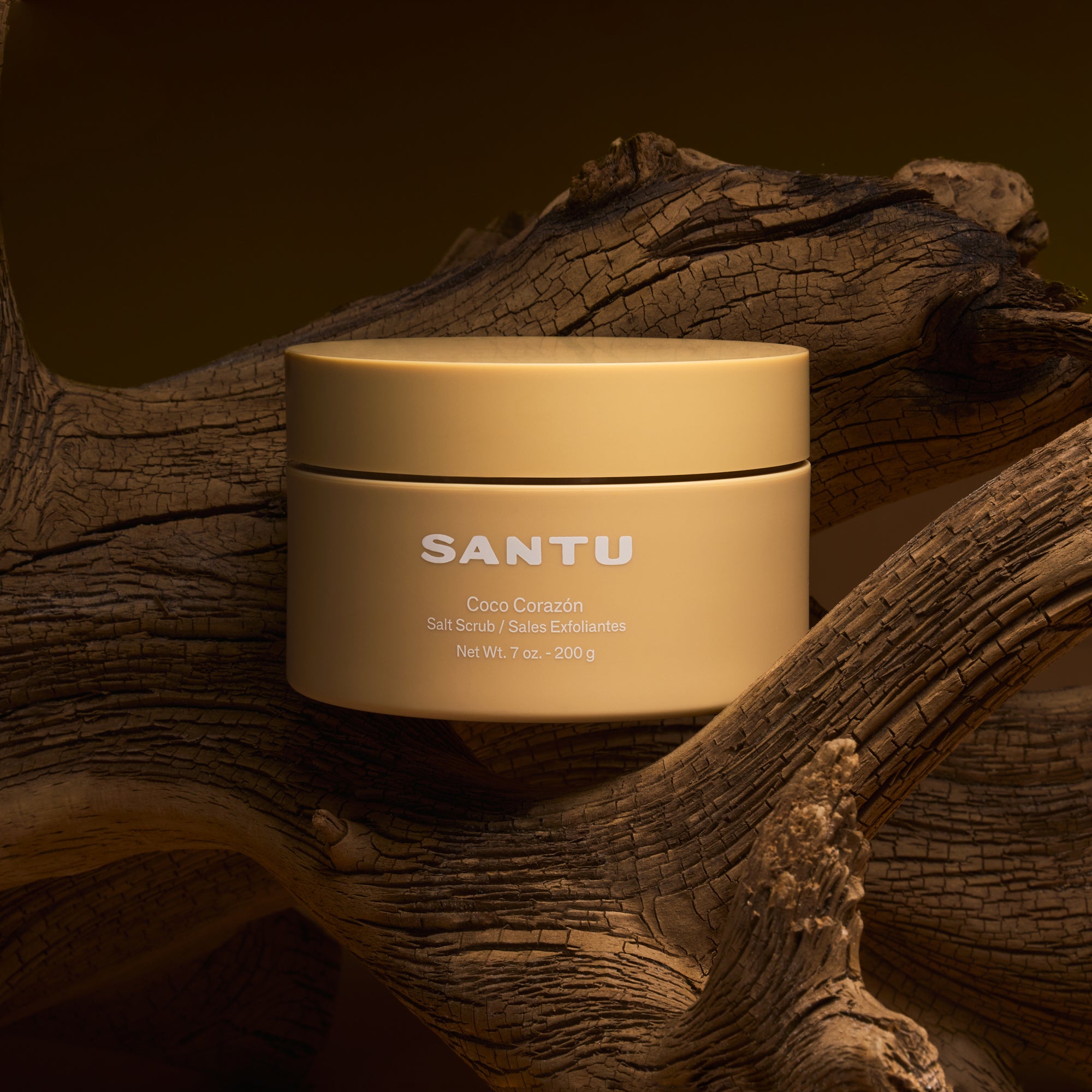 Beige jar labeled 'SANTU' on a wooden background