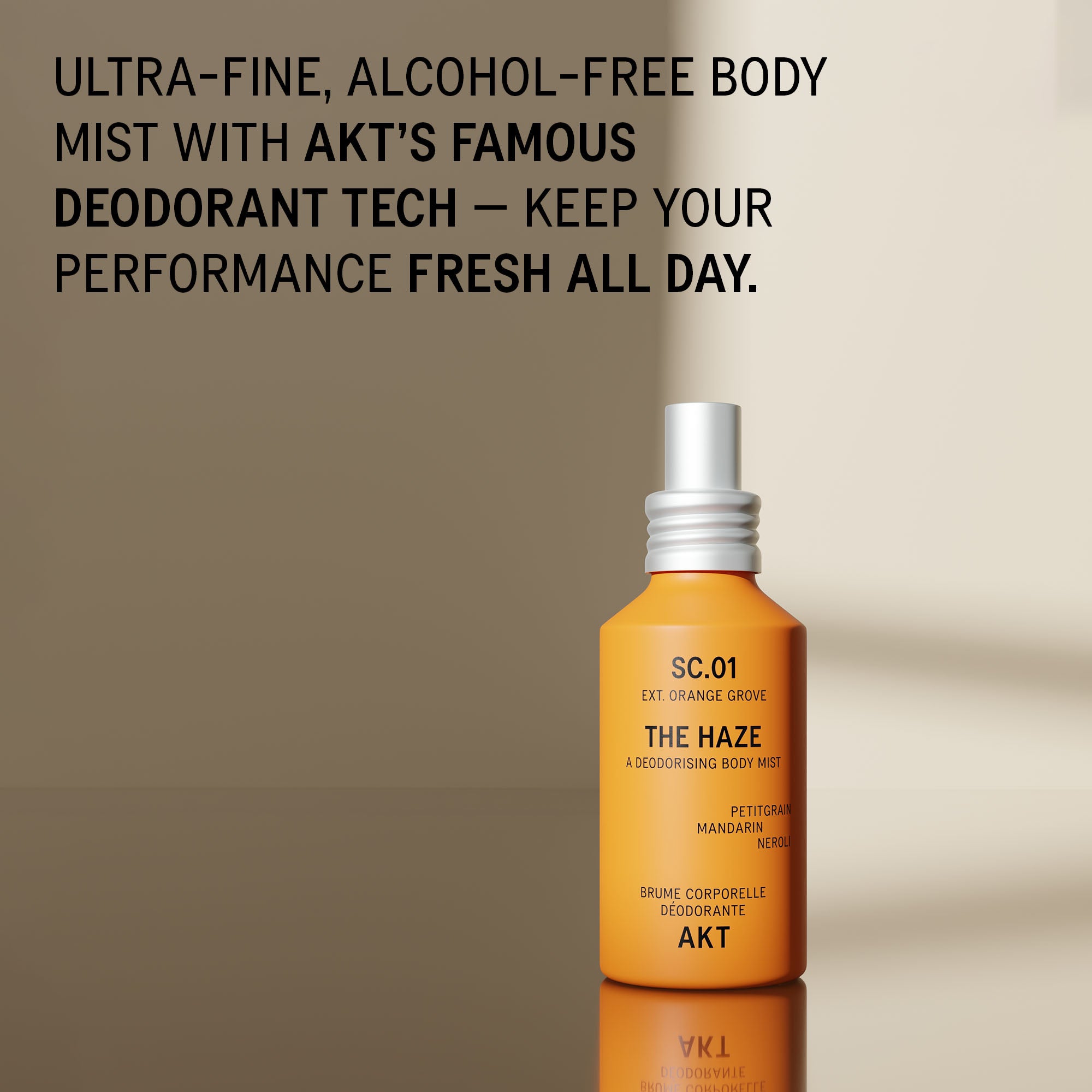 Bottle of The Haze SC.01 Orange Grove deodorant spray with a white spray nozzle, set against a warm beige background with a soft shadow. Bold black text at the top describes the product as an ultra-fine, alcohol-free body mist with AKT's famous deodorant tech.