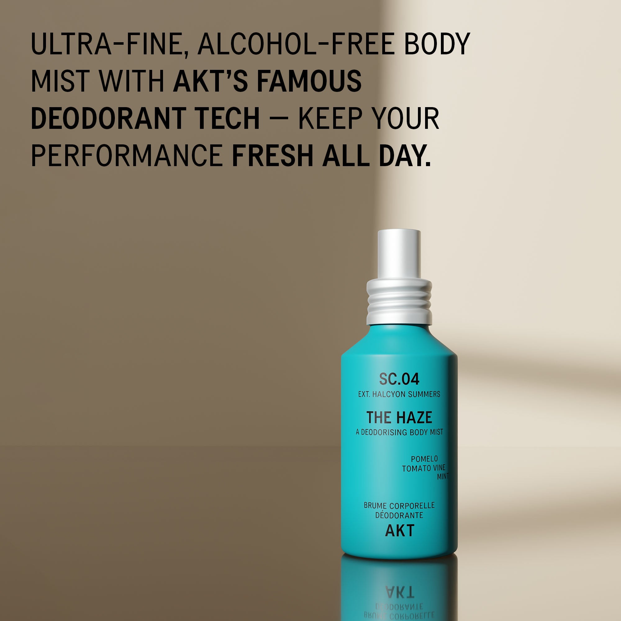 Bottle of AKT The Haze SC. 04 Halcyon Summers stands on a reflective surface against a warm beige background, with large promotional text at the top describing an alcohol-free body mist and deodorant tech.