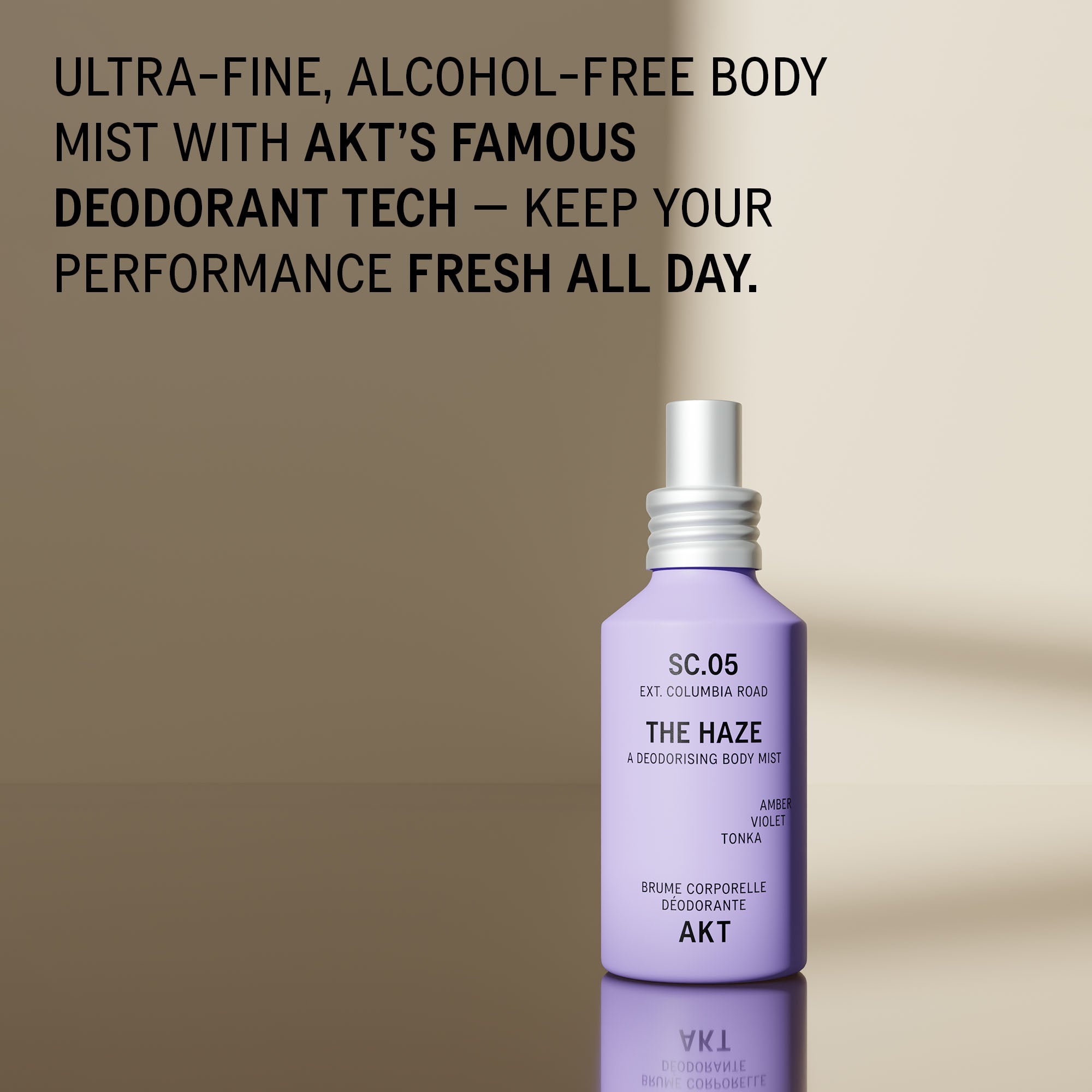 Bottle of AKT The Haze SC. 05 Columbia Road with a white spray cap, displayed on a reflective surface against a beige background with promotional text at the top.