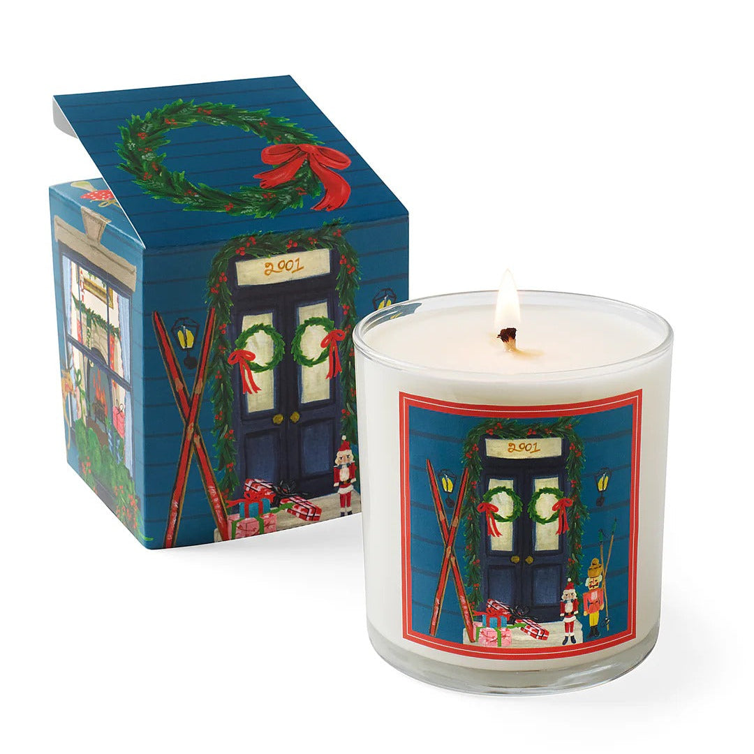 Roland Pine Candle with a decorative label next to its box on a white background