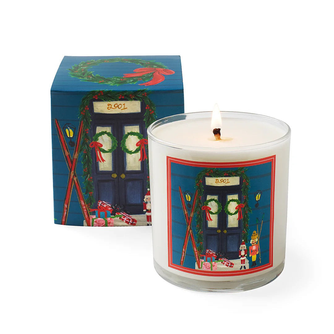 Roland Pine Candle with a decorative label next to its box on a white background