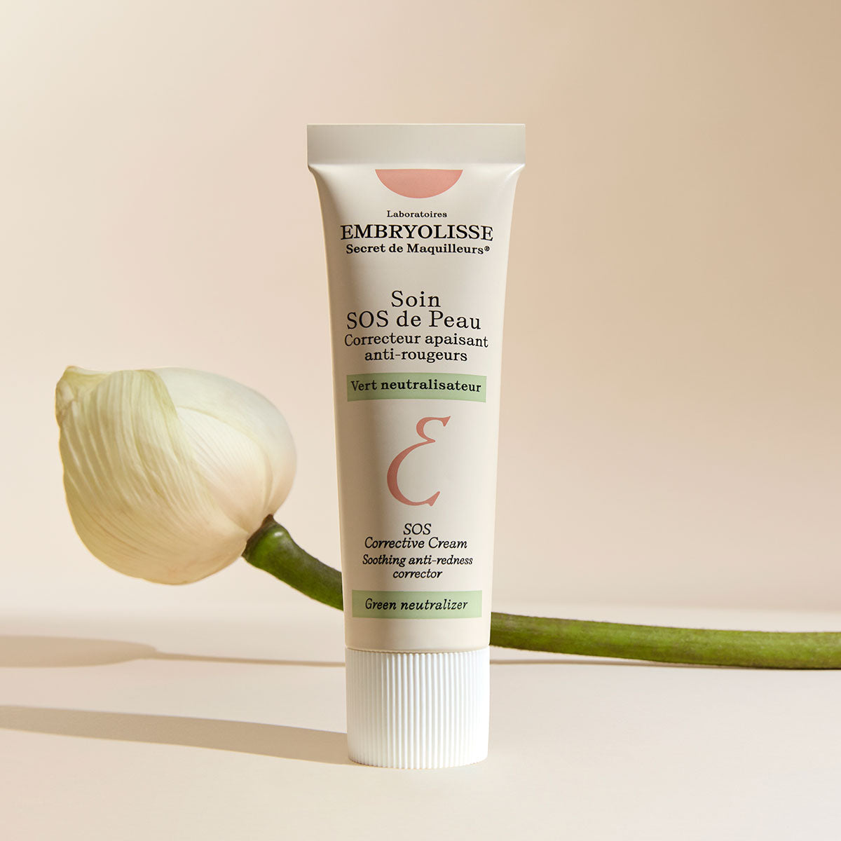 Embryolisse SOS Corrective Cream next to a flower.