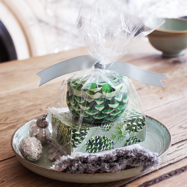 Gift Roland Pine set  on a wooden table with a blurred background