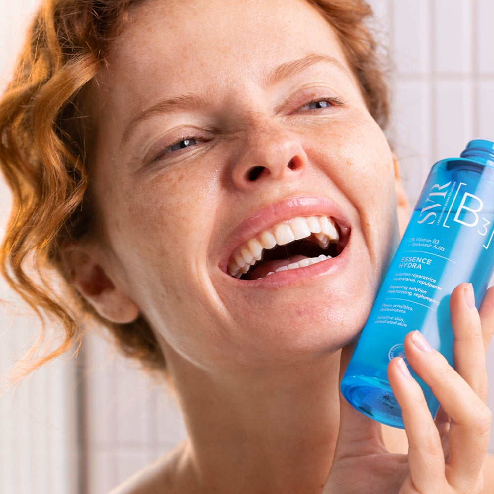 Person holding a SVR 'B3' Hydra Essence near their face.