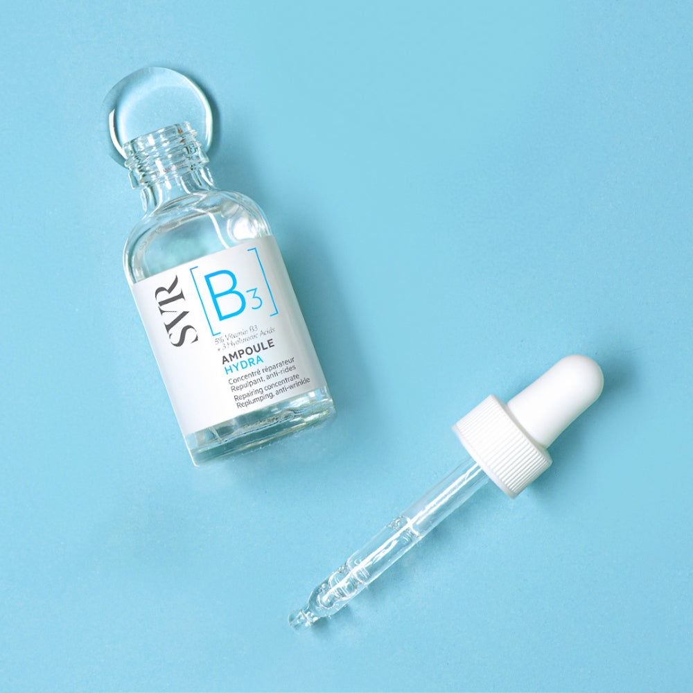 SVR B3 Repairing Concentrate serum and swatch bottle with dropper on a light blue background