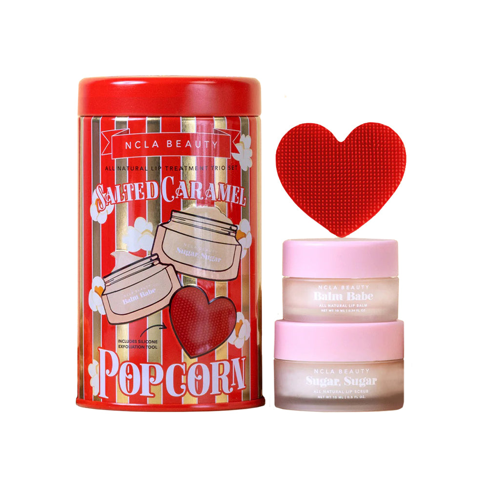 NCLA Beauty Salted Caramel Popcorn themed cosmetic set with a red heart-shaped tool on a white background.