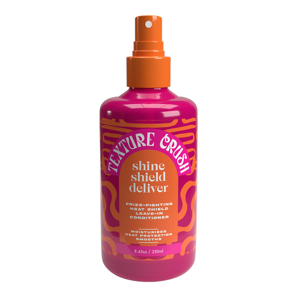 Pink bottle with orange spray nozzle labeled 'Texture Crush' on a white background