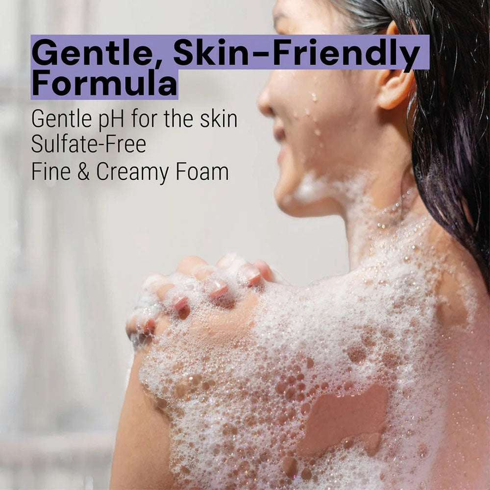 Woman lathering Panier des Sens Lavender Shower Gel on her shoulder. Text overlaid reads: "Gentle, skin-friendly formula. Gentle pH for the skin. Sulfate-Free. Fine and creamy foam."