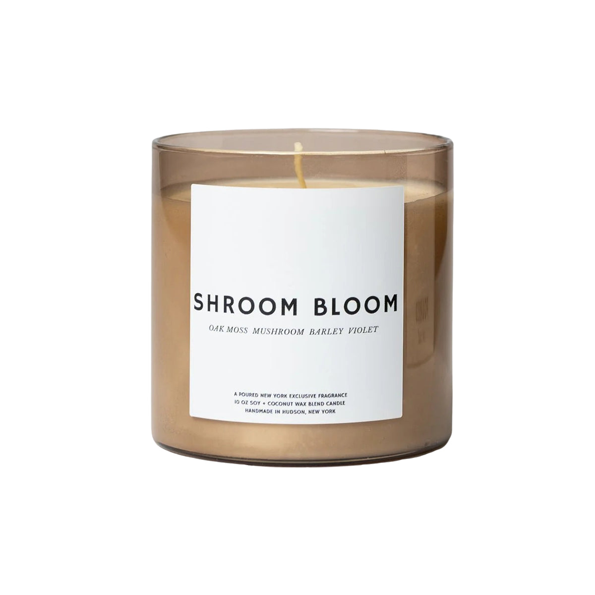 Candle with a label reading 'Shroom Bloom' on a white background