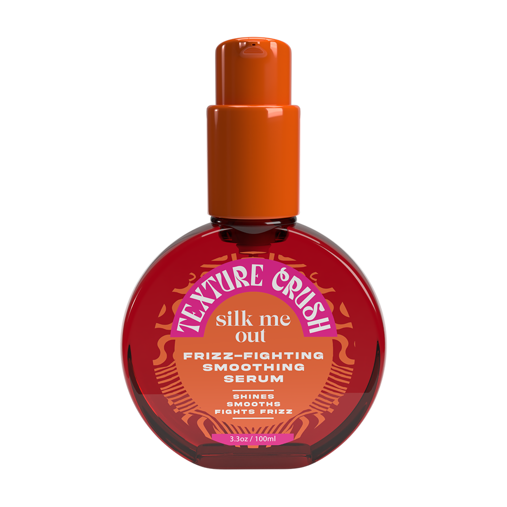 Bottle of Texture Crush Silk Me Out frizz-fighting smoothing serum with an orange cap on a white background