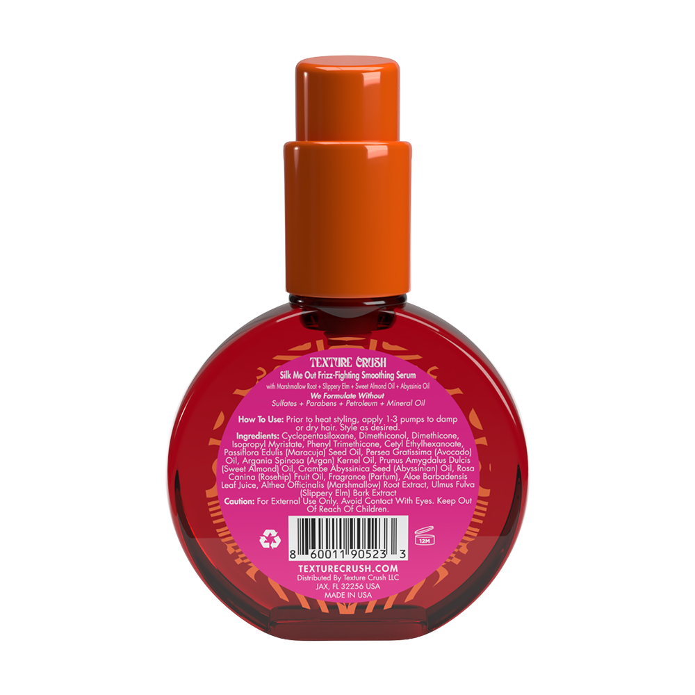 Back view of hair product bottle with an orange cap on a white background