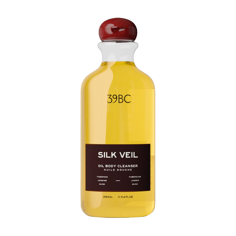 Bottle of 39BC Silk Veil Oil Body Cleanser, filled with a golden-yellow liquid and featuring a dark brown label with a glossy red cap, set against a plain white background.
