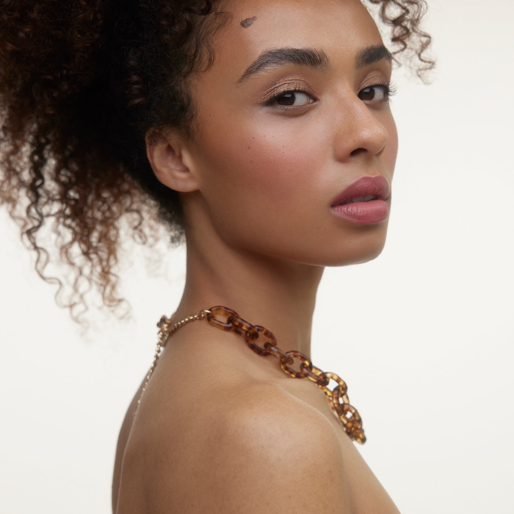 Closeup of a woman's face wearing Wonderblush makeup.