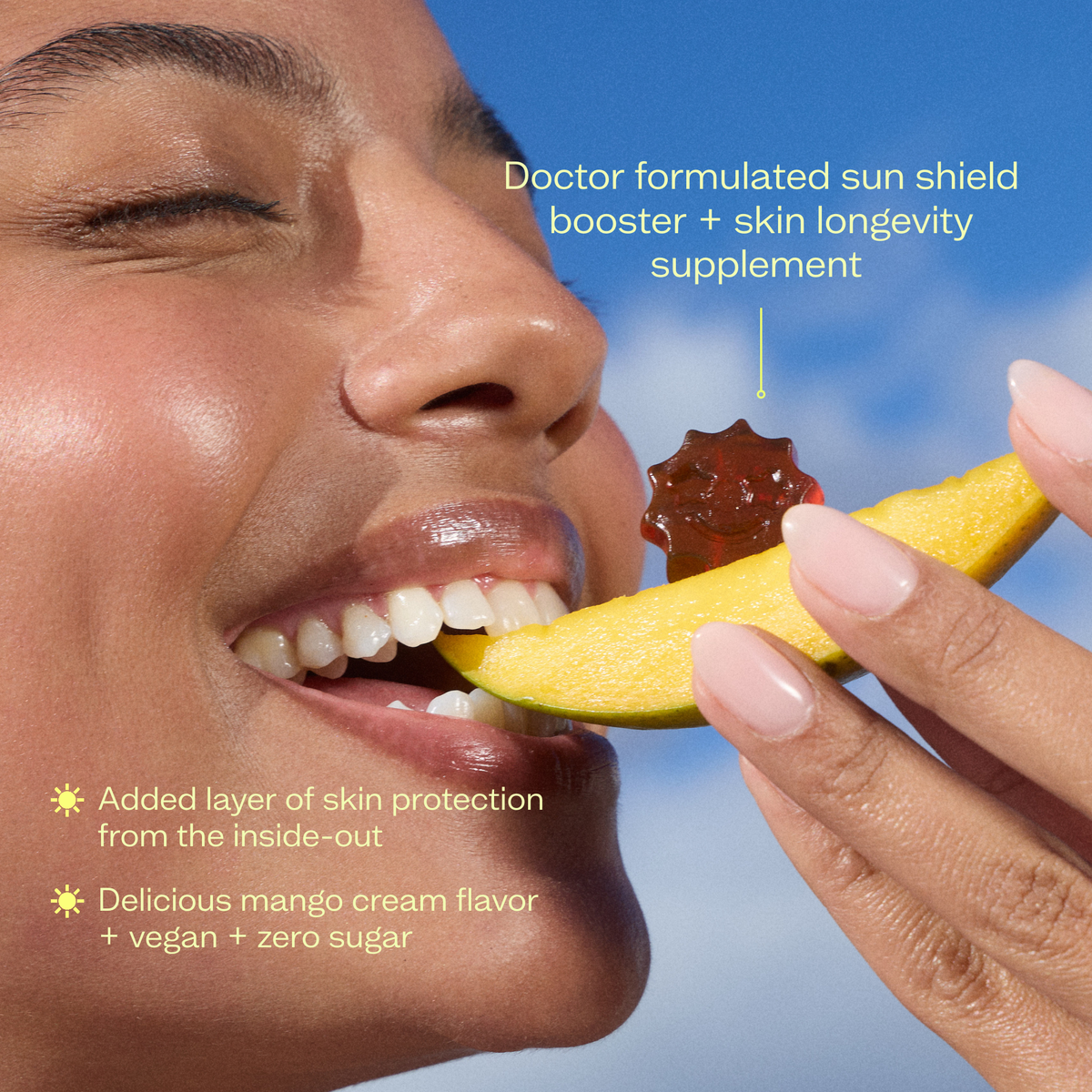 Person eating a mango slice with a Timebeam Beauty - Sol Mate Supplement Gummy on it with text about its benefits against a blue sky background