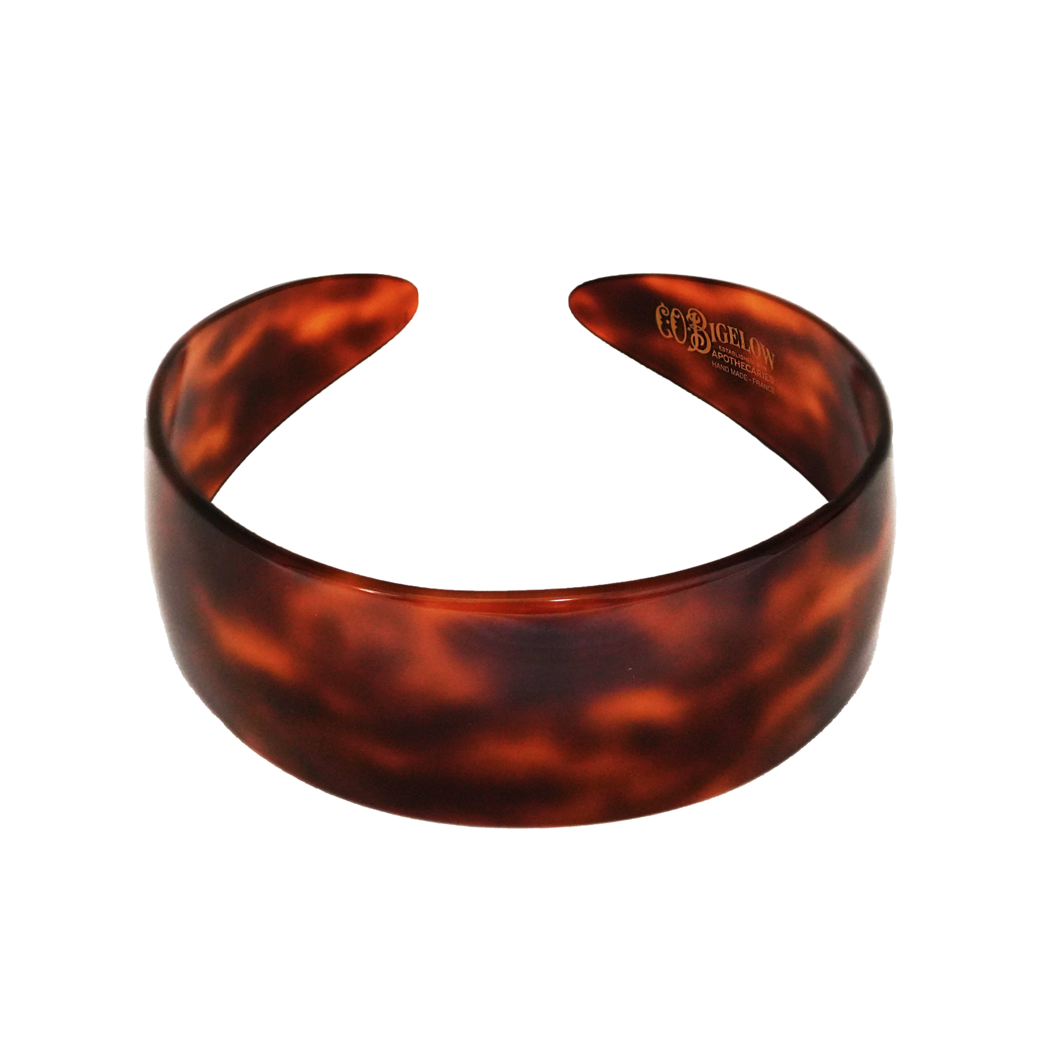 C.O. Bigelow Branded Charles Wahba Tortoise Headband on a white background. 