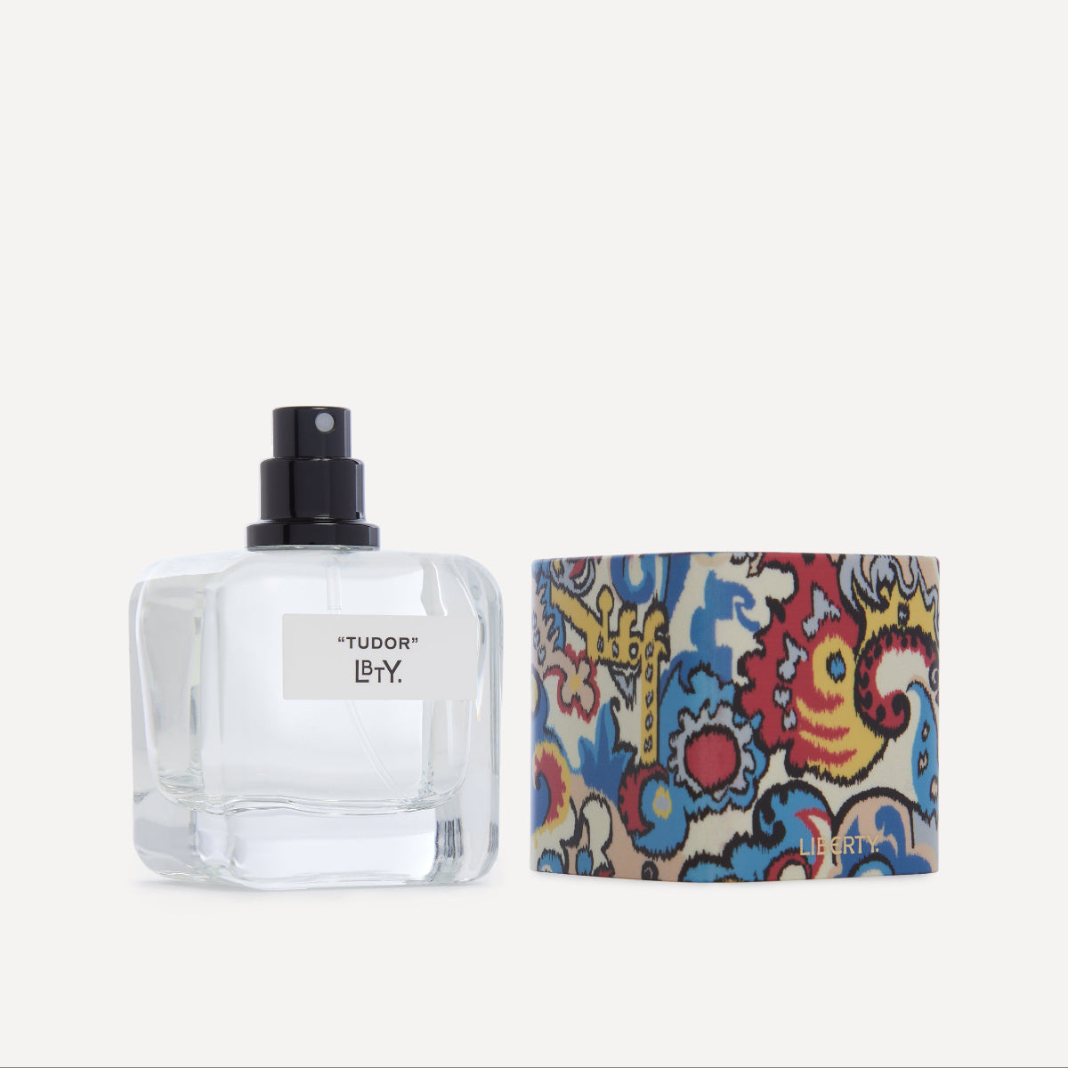 Perfume bottle with colorful packaging on a white background