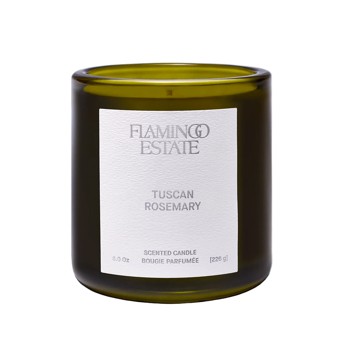 Flamingo Estate Green candle with a white label on a white background