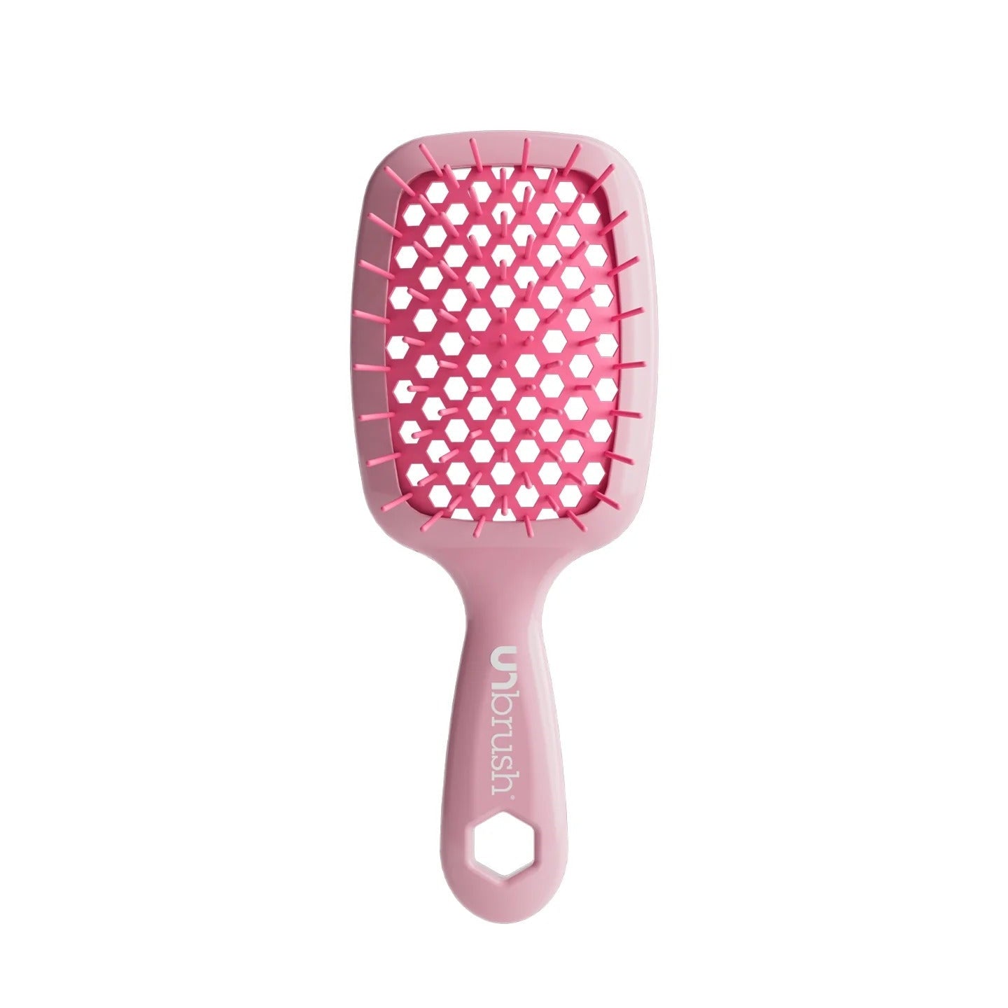 Pink hairbrush with a white background